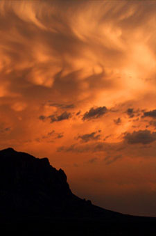 Silhouette of Superstition Mountains in clouds